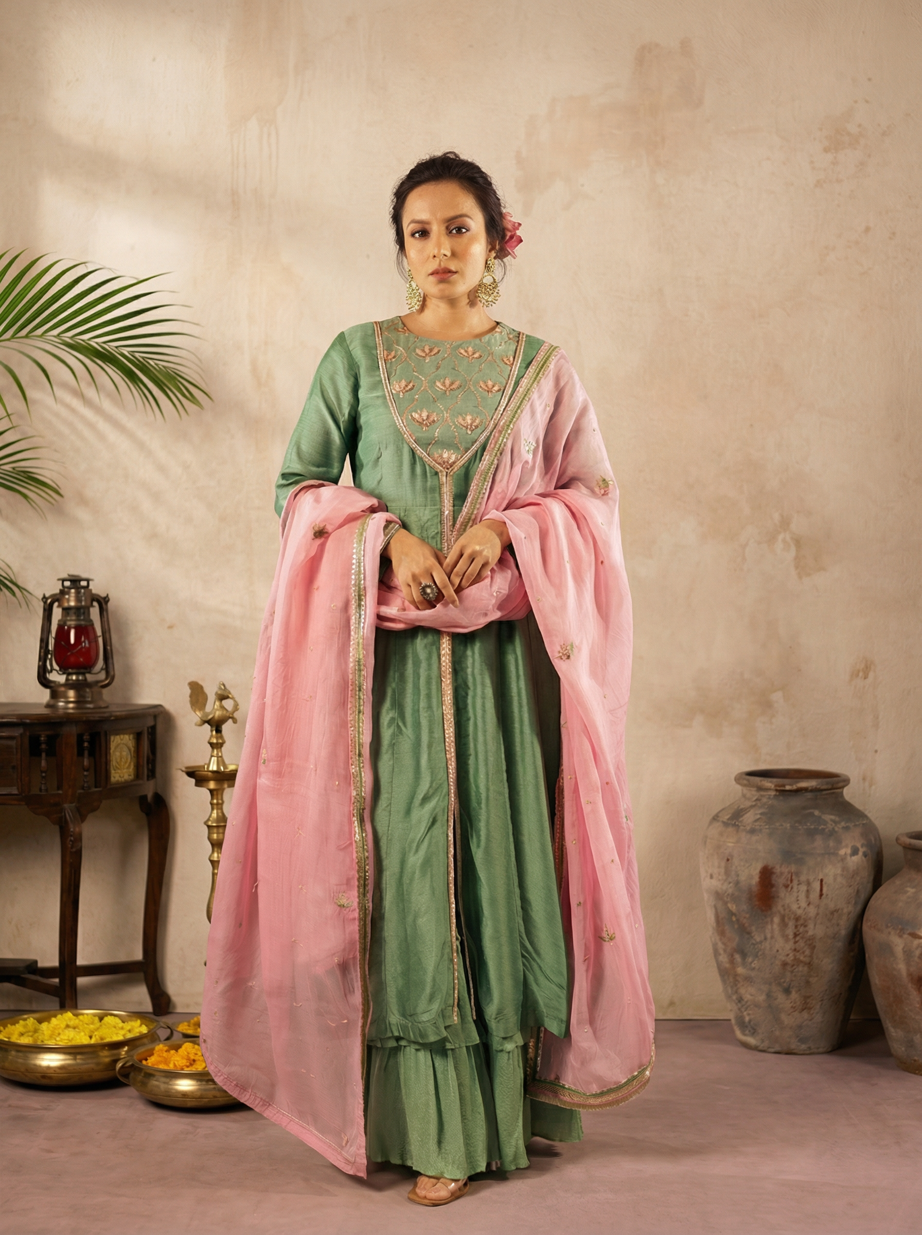AI-generated fashion visual of a woman in a green and pink embroidered traditional outfit