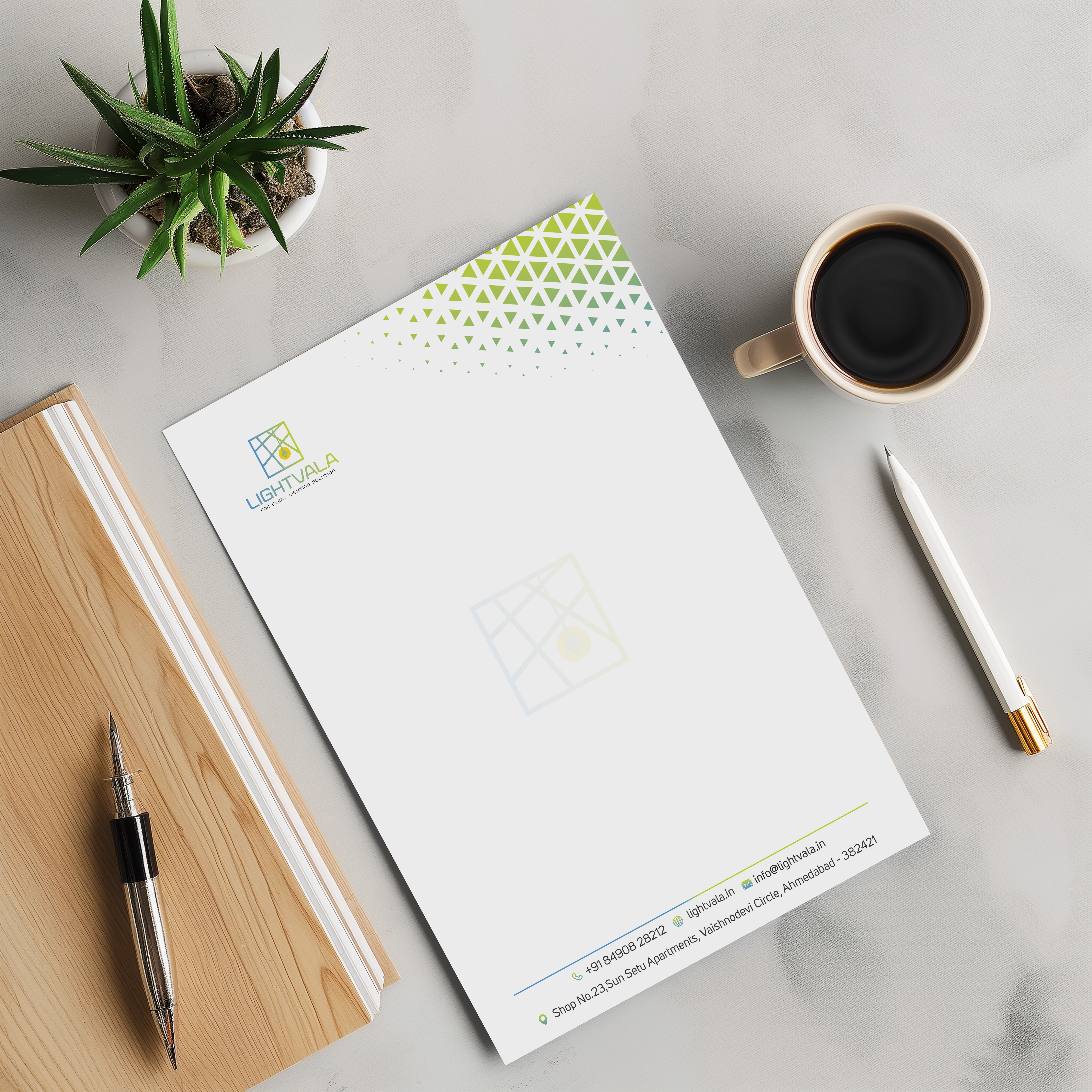 Letterhead design mockup for Lentura on a desk with coffee and stationery