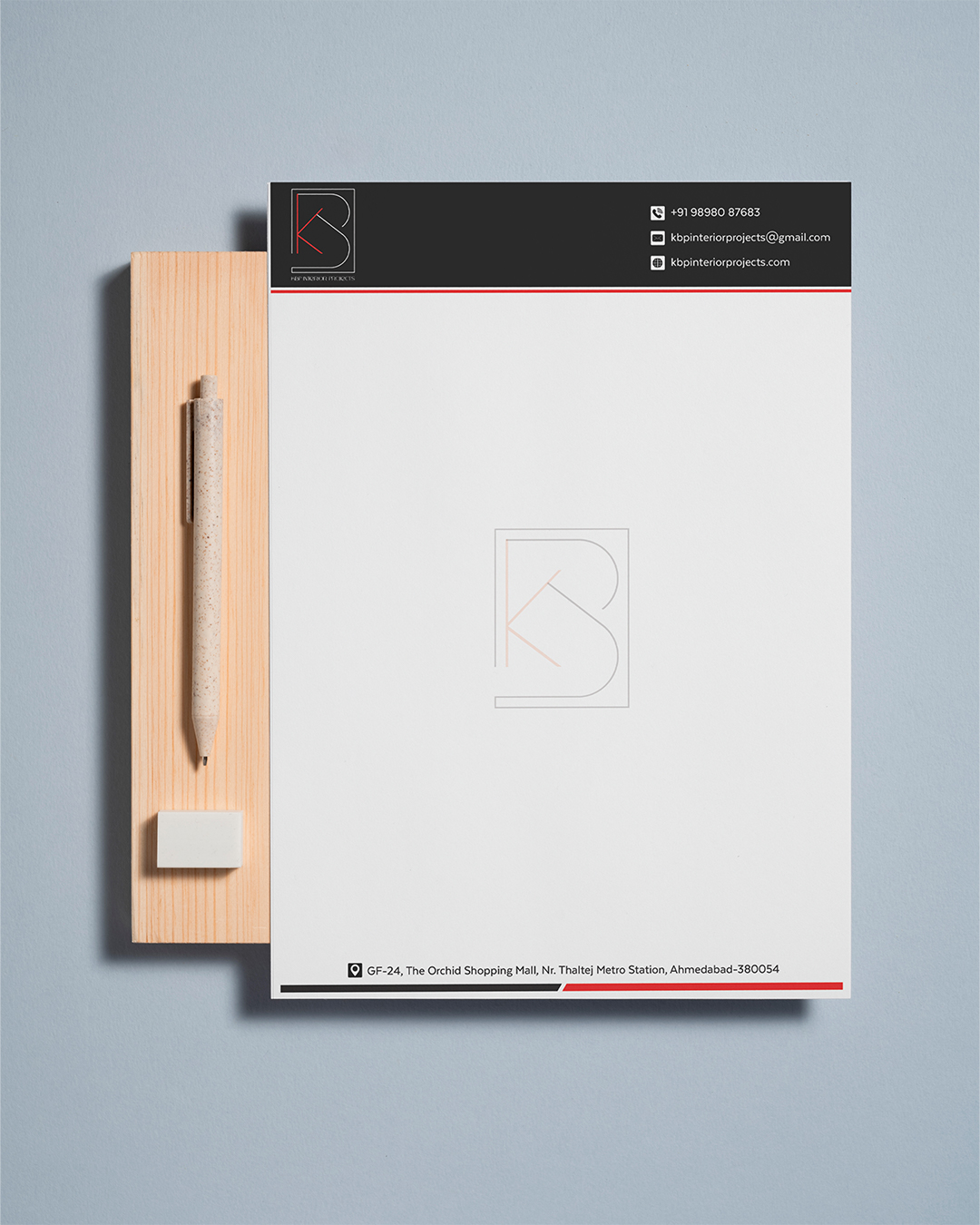 Corporate letterhead design mockup with black header on a styled desk