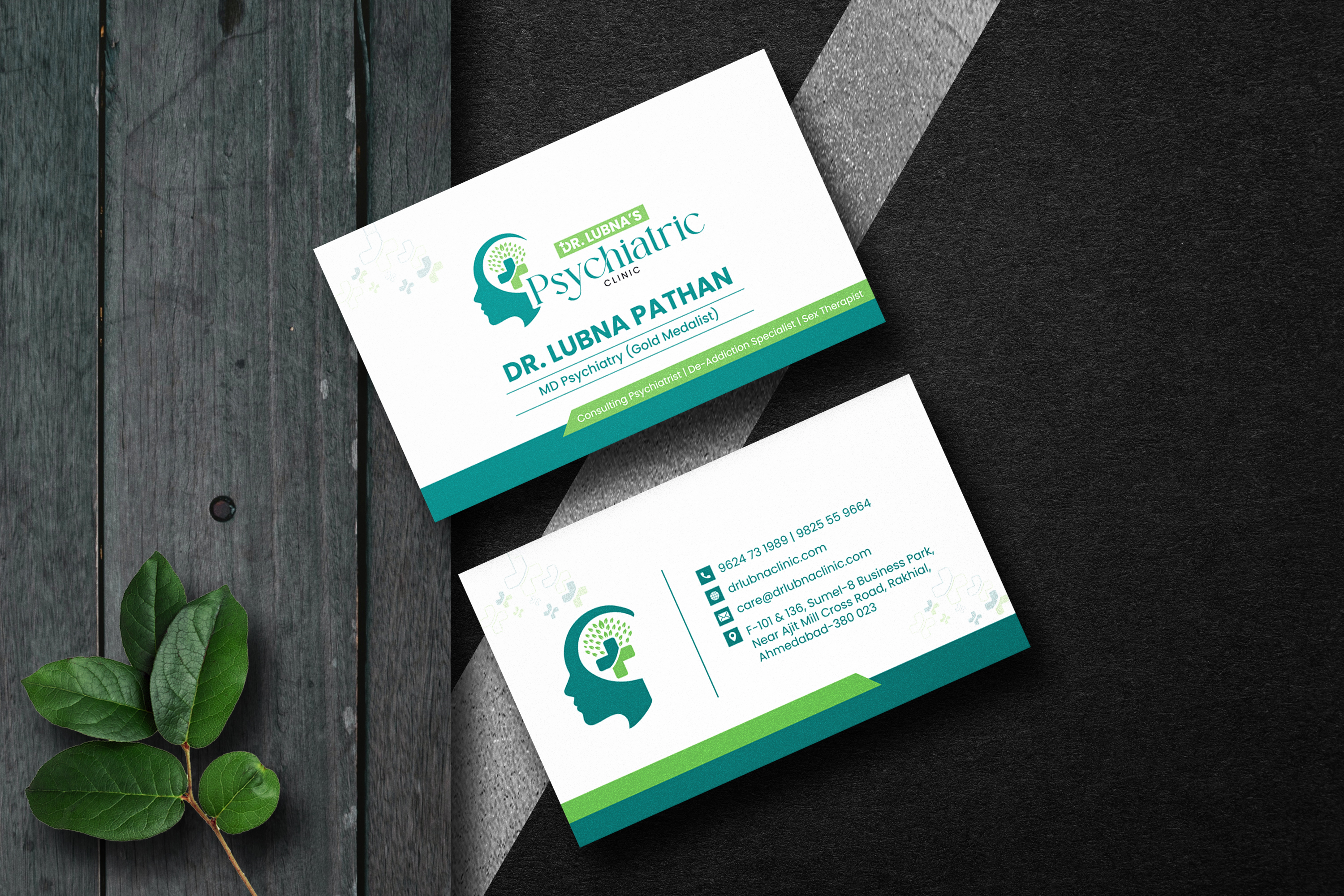 Business card design mockup for a psychiatric practice on a wood surface